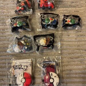 Lot of 9 McDonald’s happy meal toys.7 Mario cart /2 highly sought after Pokémon.